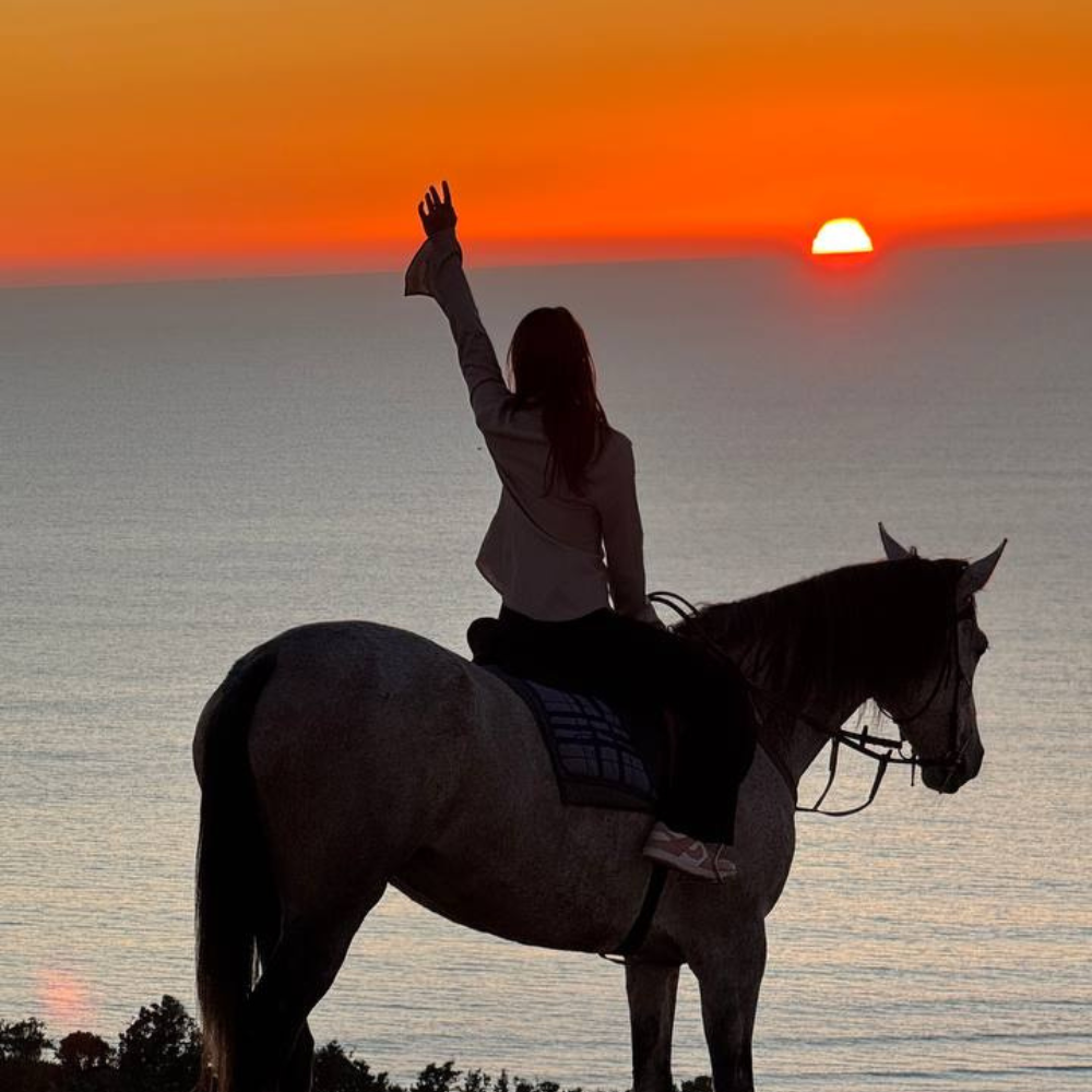 Sunset horse riding along Banana Beach near Tamraght, Morocco